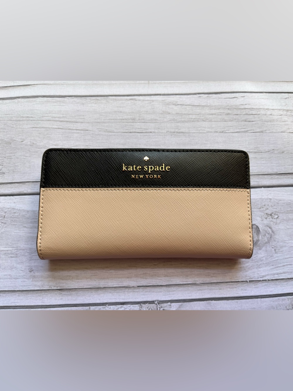 Kate Spade New York Madison slim bi fold color block wallet. Beige and black